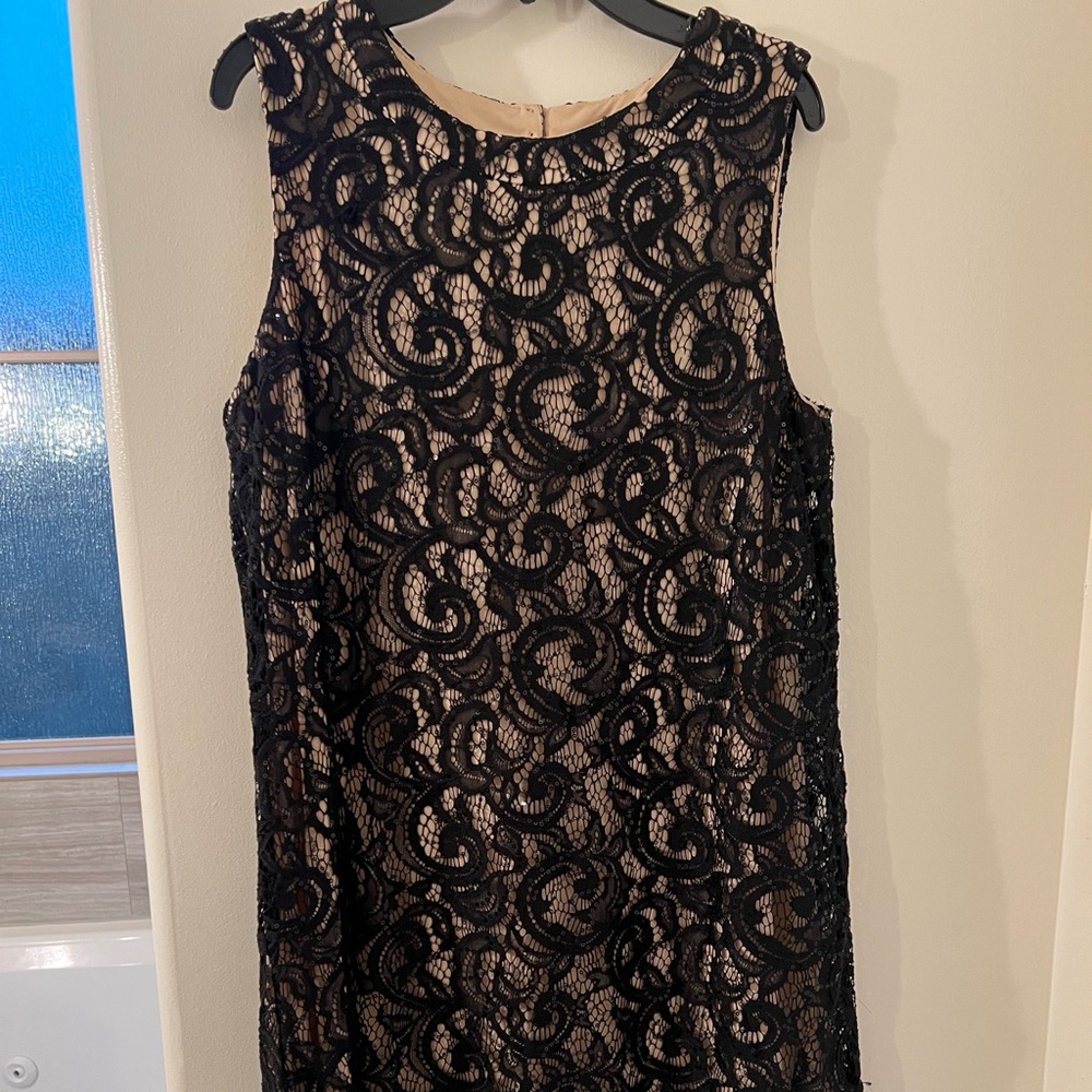 A pretty party dress. Fits to the knee